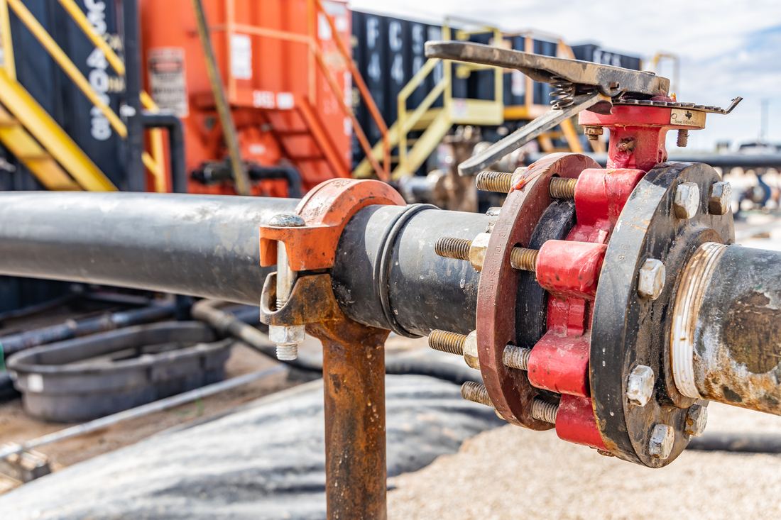 Red flanged valve on the transfer line